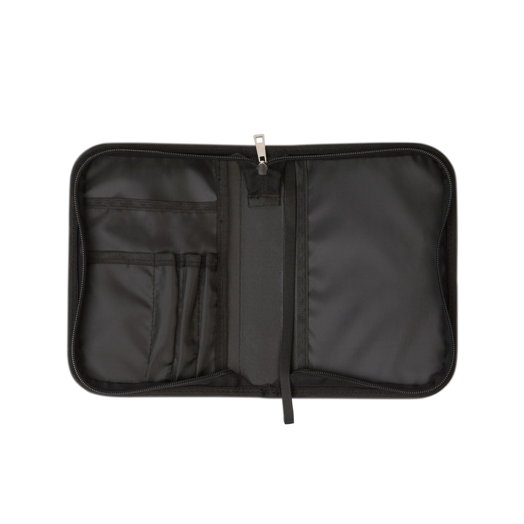 Black travel organizer with multiple compartments on a white background