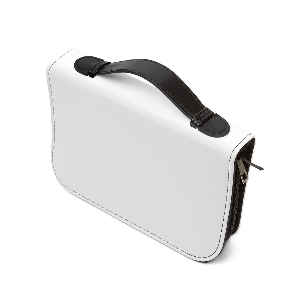 White handbag with black strap on a white background